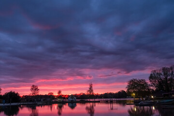A breathtaking and enchanting sunset casts vibrant and captivating colors over a serene and...