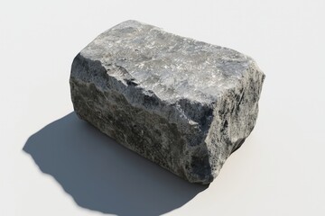 Obraz premium A solitary gray rock resting on a smooth surface, showcasing nature's rugged beauty