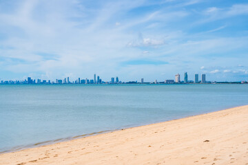 Chonburi, Thailand - May, 27, 2024 : A Clear Day’s View of Skyscrapers by the Sea, Reflecting Mankind’s Reach Towards Peaceful Living Spaces at Chonburi, Thailand