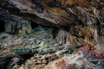 Colorful and dark texture inside the Lapa de Santa Margarida cave in the Arrábida mountain range, Setúbal PORTUGAL