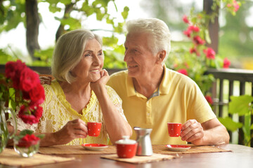 Portrait of senior couple drinking coffee at home
