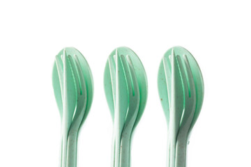 Compact set of cutlery on a white background, isolate, for trips and on the road, close-up