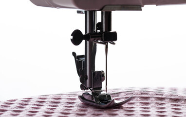 Sewing machine foot and needle plate with needle holder. Macro, industry. Copy space for text, overlock