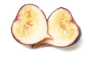 Brown Turkey fig with purple skin and soft flesh in light yellow and a hint of orange. Photographed on a white background. Also known as fig, scientific name: Ficus carica.