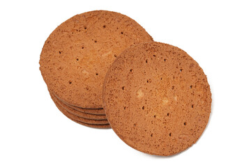 Round, flat chocolate-flavored crackers with a brown color, neatly stacked. Perfect as a snack. Photographed on a white background.