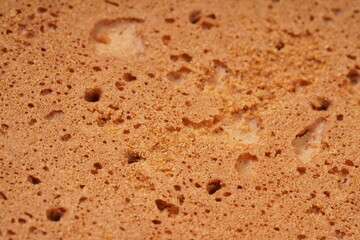 Round, flat chocolate-flavored crackers with a brown color, neatly stacked. Perfect as a snack. Photographed on a white background.