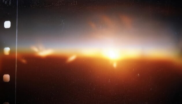 Warm Lens Flare through a smeared glas shot on 8mm Film with some film fragments grunge texture Bokeh