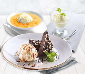 ice cold cute yellow mango pomelo fruit pudding jelly on plate with vanilla ice cream chocolate brownie cake fruit decor sweet western dessert cafe halal restaurant kids menu set