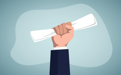 Human hand holding a document.Obtaining a certificate or academic degree.