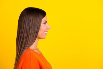 Close up side portrait of healthy young woman with long hair smiling