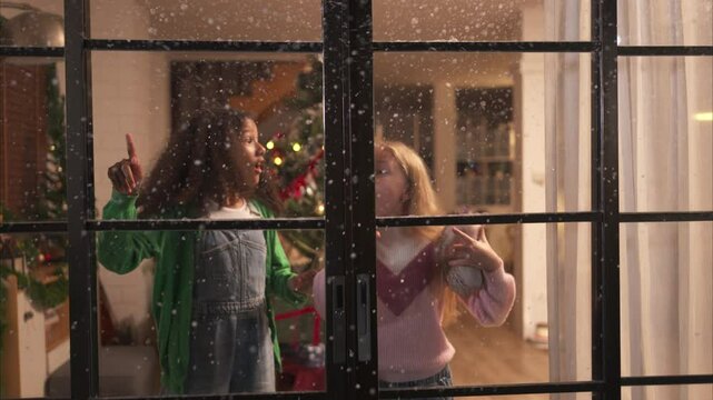 Parents and a teen girl on Christmas night with the first snowfall
