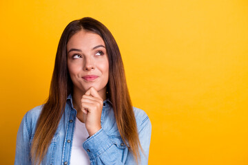 Photo of adorable positive lady look empty space hands cheeks wear white shirt isolated yellow color background