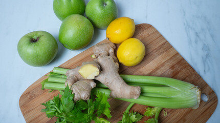 Green apple ginger lemon and celery stalks. detox concept and healthy food
