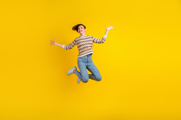 Obraz premium Full body photo of young girl jumping dressed stylish outfit isolated on purple color background
