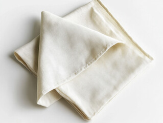 Naklejka premium Elegant linen fabric neatly folded showcasing its texture and natural hue in soft ambient light