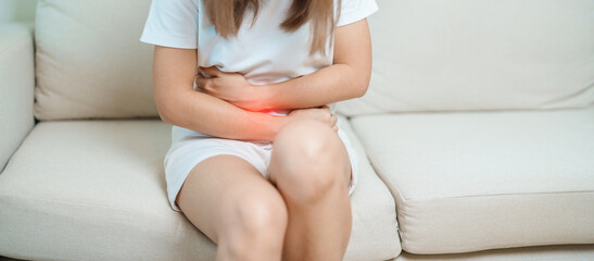 woman having abdomen ache due to Stomach pain, digestion with constipation or Diarrhea from food...