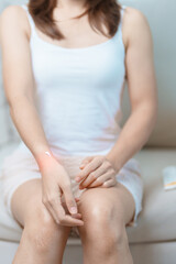 Arthritis and Muscle Pain Relief Cream concept. Woman having wrist pain at home, muscle ache due to De Quervain s tenosynovitis, ergonomic, Carpal Tunnel Syndrome or Office syndrome and Parkinson