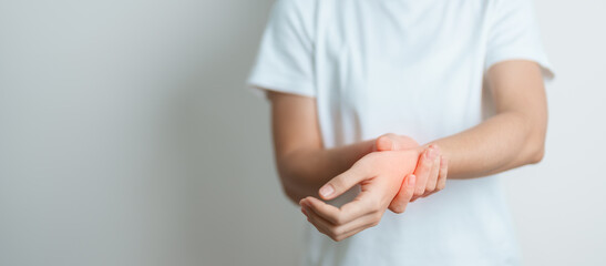 Woman having wrist pain at home, muscle ache due to De Quervain s tenosynovitis, ergonomic, Carpal Tunnel Syndrome or Office syndrome and Parkinson disease concept