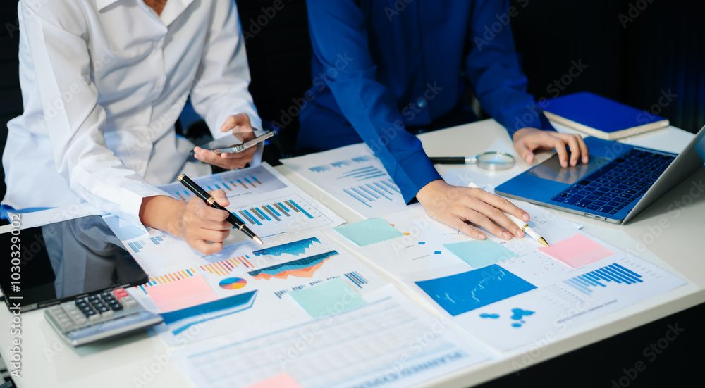Poster business documents on office table with smart phone and calculator digital tablet and graph business