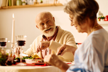 A loving senior couple celebrates Christmas with a festive dinner, filling their home with joy.