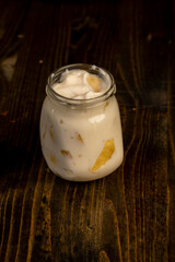 pear yogurt with pieces of fruit on the table