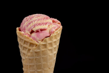 waffle cone with ice cream and pieces of melon and watermelon