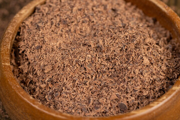 round wooden bowl with chocolate pieces and chips