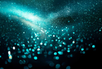 Abstract bokeh background with teal and blue glowing circles on a dark backdrop.