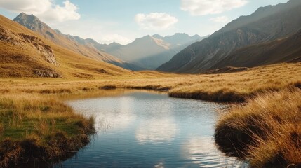 A peaceful mountain landscape featuring a calm body of water that reflects the clear blue sky and surrounding grassy hills under a soft golden light.