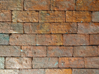 Old orange brick wall, rough surface