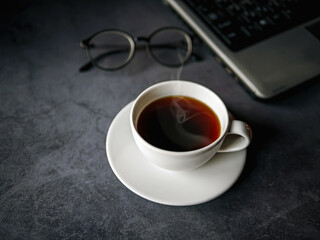 Relax during business work concept, americano coffee cup and black coffee cup aromatic and laptop computer in morning