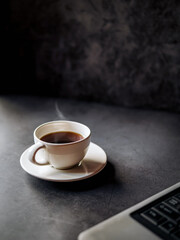 Relax during business work concept, americano coffee cup and black coffee cup aromatic and laptop computer in morning