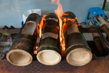 bamboo tube chicken in the process of roasting