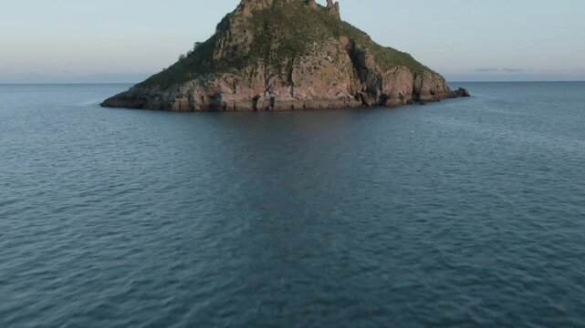 Thatcher Rock Torquay Drone Footage In the English riviera, sunny day, beautiful sky Ariel view of scenic landscape With moon in background Low to high