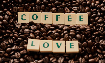 Beans, organic and letters with coffee, words and love for brewing, roasting and natural caffeine industry. Tiles, texture and spell for espresso, grinding and beverage production with sustainability