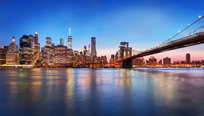 Brooklyn Bridge and Manhattan skyline during twilight, city lights reflecting on water, concept of urban landscapes