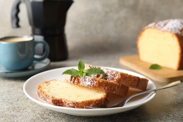 Freshly baked sponge cake and coffee on light grey table