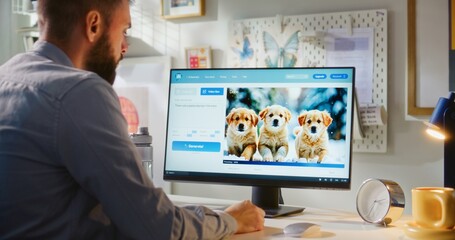 Adult man enters text prompt in AI video generator on computer. PC screen shows AI generated...
