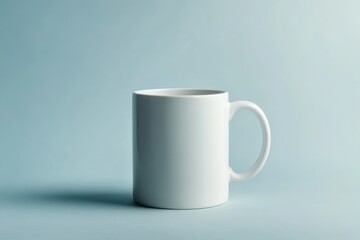 Obraz premium Minimalist White Mug on Clean Blue Background