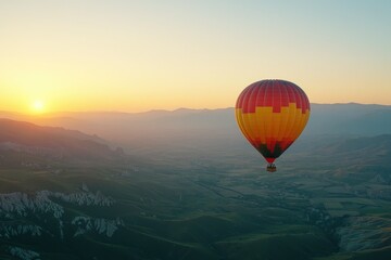 Fototapeta premium Majestic Hot Air Balloon Glowing in Vibrant Sunset Sky