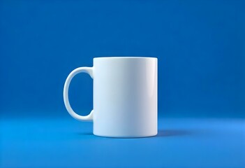 Obraz premium A white ceramic mug on a blue background