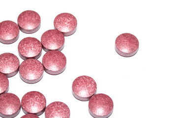 Vitamin Capsules and Pills on a White Background For Medication round and long shaped