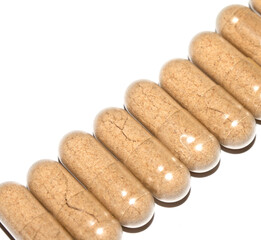 Vitamin Capsules and Pills on a White Background For Medication round and long shaped