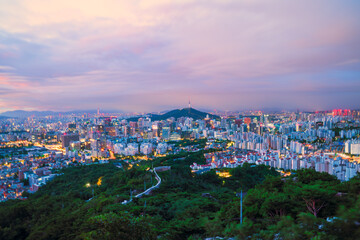 Jongno-gu, Seoul, South Korea at dawn. Bird's-eye view of Seoul Fortress on Inwangsan Mountain with Seoul in the background.