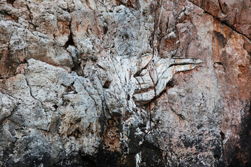 Brown colored Basalt sheer rocks  cuted by cracks due geology and by constant wind and temperature fluctuations. the different rocks that make up the mountain create whimsical patterns