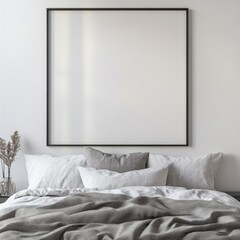 Minimalist bedroom with neutral-toned bedding and large empty picture frame on wall