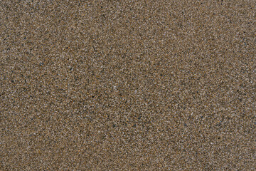 Close up of sand pattern at beach. Seamless sand. Brown sand. Sand texture.