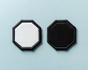 Two blank octagon shaped patches, one black and one white, perfect for branding or adding a unique design.