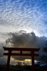 Red Torii Gate at Sunset: Serene and Dramatic
