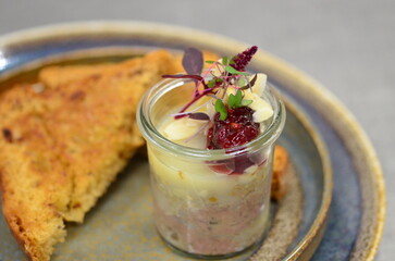 Traditional Pork Pâté with Cranberries and Toasted Bread Served in a Restaurant